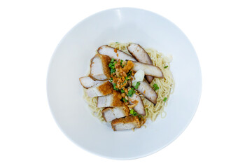 Top view of Dry noodles with roast pork, focus selective
