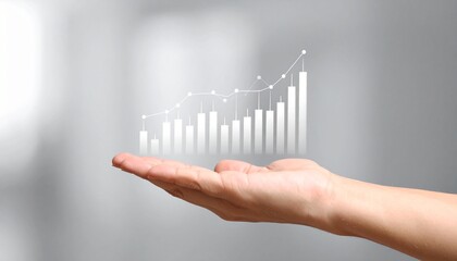 A line graph showing real-time stock price trends floating above a hand on a blurred grey background