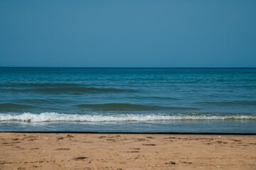 the sandy seashore in Anapa after the oil spill in the Black Sea