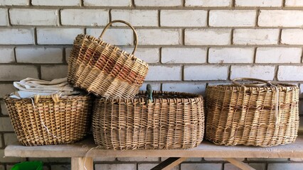 wicker basket on a wooden table, baskets made of willow twigs, handmade