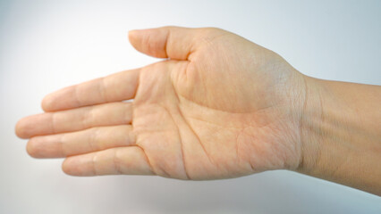 Female Hand with Open Palm Gesture Expressing Request or Hope
