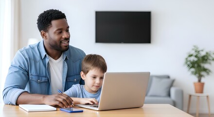 Smiling father and son using laptop for remote education or online learning