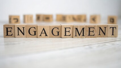 Wooden cubes spelling "ENGAGEMENT" with defocused social media metrics behind
