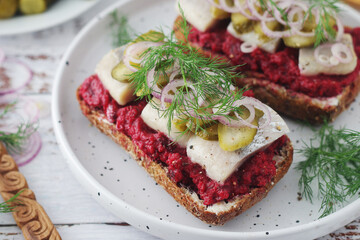 Scandinavian sandwiches with herring and beetroot