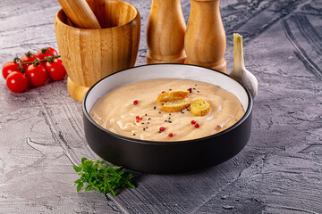 Tasty cheese cream soup with crouton