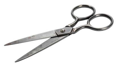 Old vintage tailor or seamstress scissors with aged metal blades and classic handle design. High-resolution and isolated on a white background