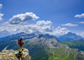 Hiker in front of the Dolomite mountain scenery, Ampezzaner Dolomiten (SOIUSA) , Italy