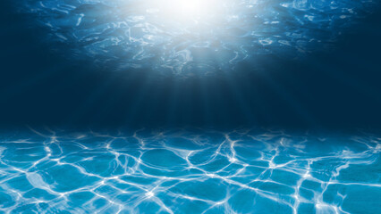 Bright underwater waves and sunlight shines through the water.