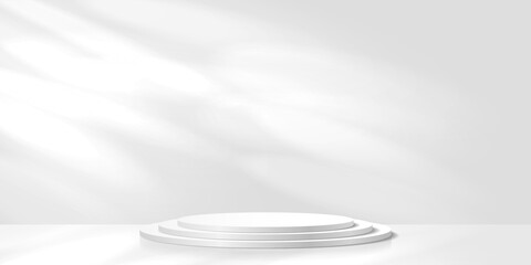 White 3D podium of three cylinders against the background of a wall with sun glare.