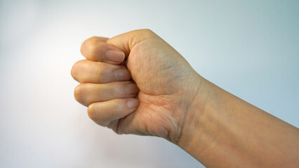 Strong Fist Gesture by Female Hand on White Background