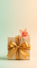 A gift box with a golden ribbon and orchid flower is beautifully presented