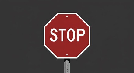Red stop sign on dark background