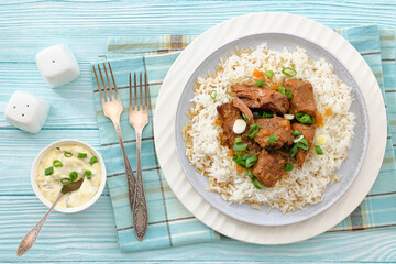 beef slow cooked with gravy served over rice
