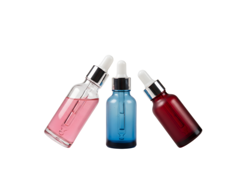Set of elegant glass dropper bottles with golden lids and colorful serums — perfect for skincare, essential oils, cosmetics, and beauty product branding. Isolated on a transparent background.