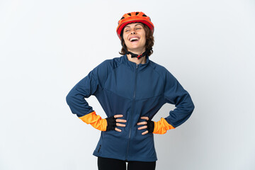 Young English cyclist woman isolated on white background posing with arms at hip and smiling