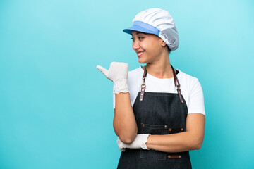 Fishwife Argentinian woman isolated on blue background pointing to the side to present a product