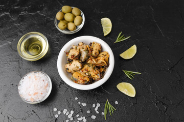 Seafood salad with rosemary and lime on black background for healthy lunch or Mediterranean snack concept