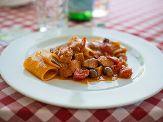 italian pasta called paccheri with tuna and olives