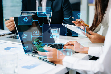 Business team people planning hand using laptop for working technology and business Net zero and...