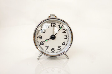 Classic Chrome Vintage Alarm Clock Showing 8:00 AM Isolated on White Background with Copy Space
