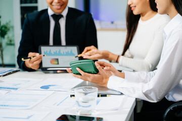 Obraz premium Business documents on office table with smart phone and calculator digital tablet and graph business with social network diagram