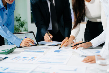 Business documents on office table with smart phone and calculator digital tablet and graph business with social network diagram