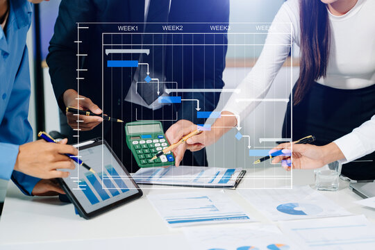 Project manager working and update tasks with milestones progress planning and Gantt chart scheduling diagram.