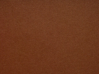 A rich terra cotta canvas, the paper's texture beckons with earthy warmth and an ancient, enduring charm