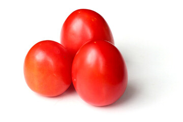 Ripe red tomatoes on white background