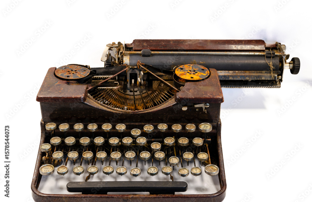 Fototapete close up of an old dirty and rusty typewriter on a white background with the concpet that the past i