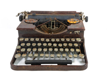 Close up of an old dirty and rusty typewriter on a white background with the concept that the past is gone