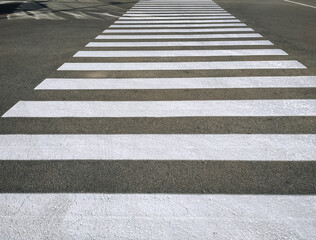 Pedestrian crossing, large white stripes of paint on the asphalt.