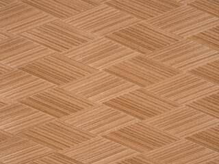 Elegant crisscrossing wooden veneer with a smooth finish and natural tones.