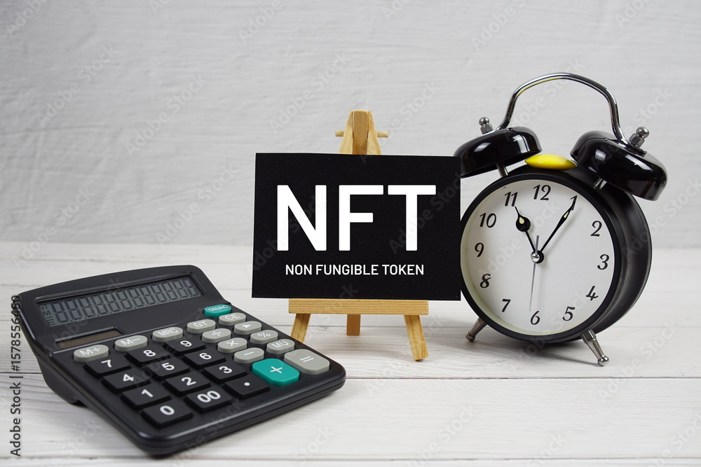 Fototapete nft abbreviation of non fungible token text with alarm clock on wooden background