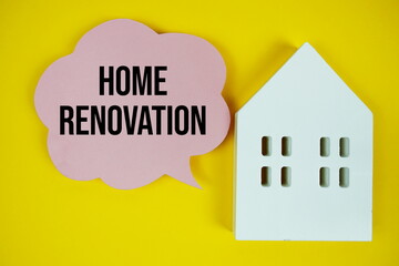 Home Renovation text message on speech bubble with house model on yellow background