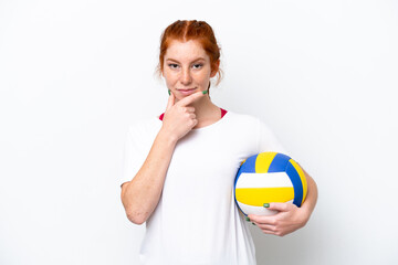 Young caucasian reddish woman playing volleyball isolated on white background thinking