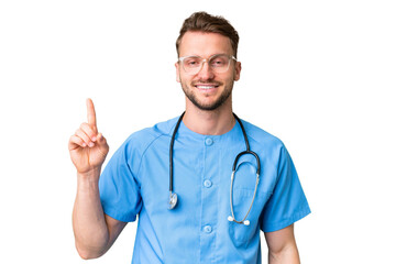 Young nurse man over isolated chroma key background showing and lifting a finger in sign of the best