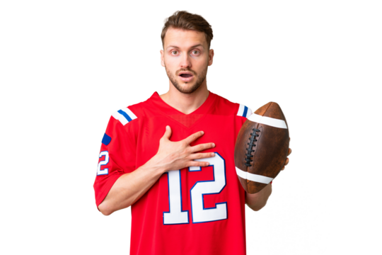 Young caucasian man playing rugby over isolated chroma key background surprised and shocked while looking right