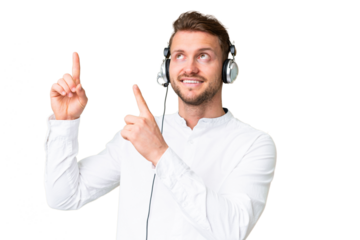 Telemarketer caucasian man working with a headset over isolated chroma key background pointing with the index finger a great idea
