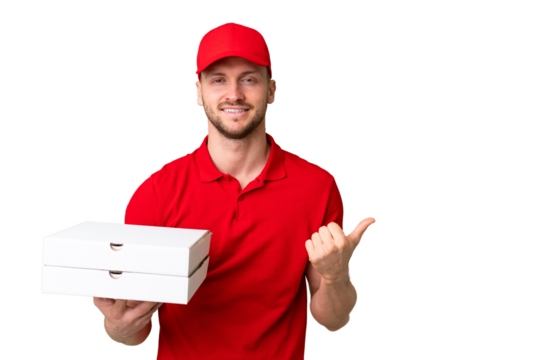Pizza delivery man with work uniform picking up pizza boxes over isolated chroma key background pointing to the side to present a product