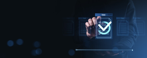 Digital tax document approval concept with holographic forms and checkmark interface on a dark...