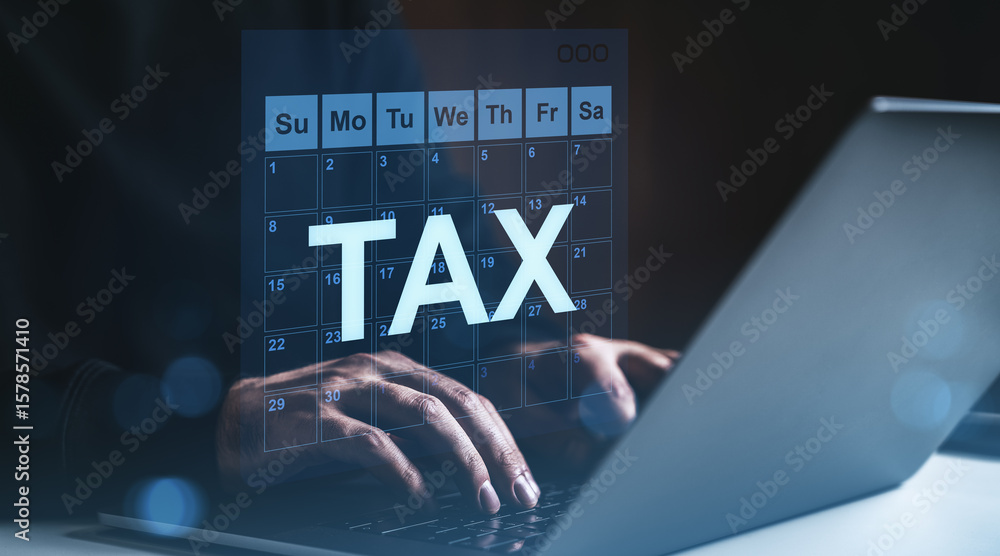 Aufkleber tax filing deadline concept with digital calendar and laptop in low light workspace showing hands ty