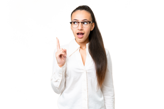 Young Arabian woman over isolated chroma key background thinking an idea pointing the finger up