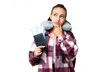 Young Traveler woman holding a passport over isolated chroma key background having doubts