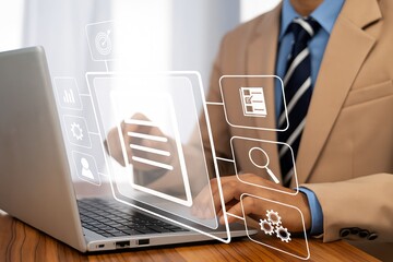 Man in Suit Navigating Digital Workplace: Laptop Interface with Integrated Business Applications for Seamless Workflow and Enhanced Productivity in Digital Transformation.