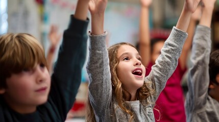 Excited schoolchildren raising their hands in a classroom, eager to participate and answer questions during a lesson.