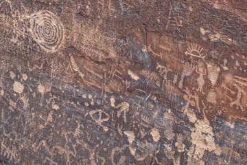 Newspaper Rock Petroglyphs Archeological District, Petrified Forest National Park, Arizona. Desert varnish. Chinle Formation, Blue Mesa Member. Mudstone with minor siltstone and sandstone.