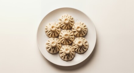 Khinkali Dumplings on White Plate Top-down with Dim Lighting
