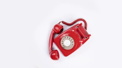Vintage red rotary phone isolated on white background.  Perfect for nostalgic communication concepts.  Great for blogs, websites, and retro designs. - Powered by Adobe