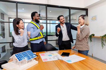 team of multiethnic coworker raise hand for success meeting on solar roof system project,...